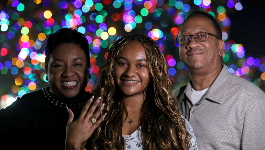 Student with ring and family
