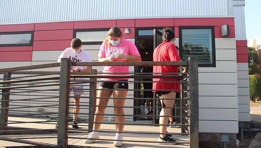 Students repainting Solar House