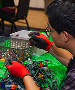 student working on lights