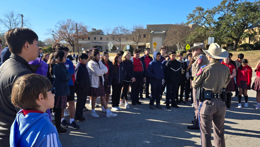 Blessed Sacrament Catholic School students talking with Texas Highway Patrol Troopers