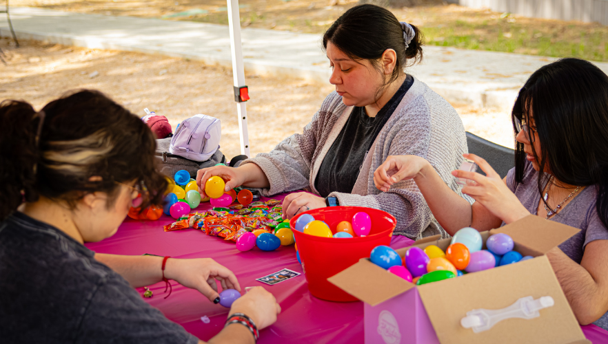 Student filling Easter eggs