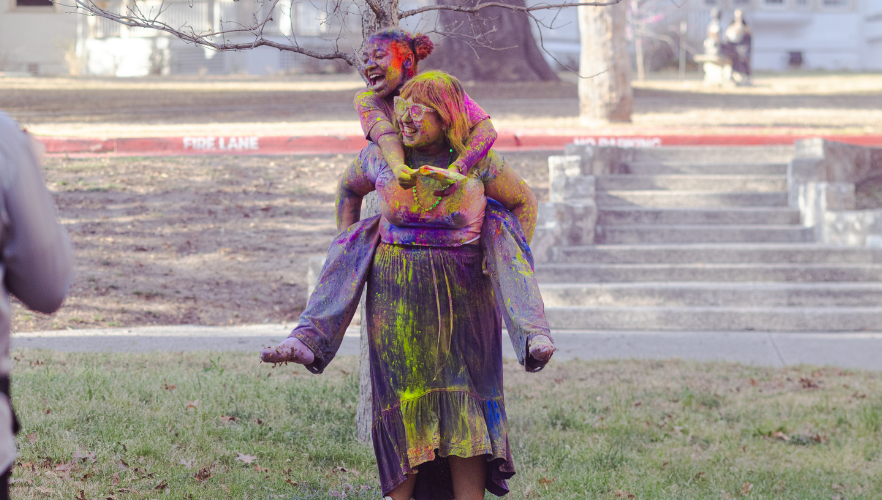 Students at Holi color throw