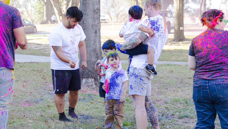 Students at Holi color throw