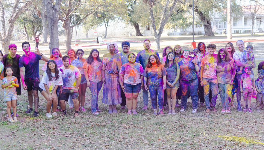 Students at Holi color throw