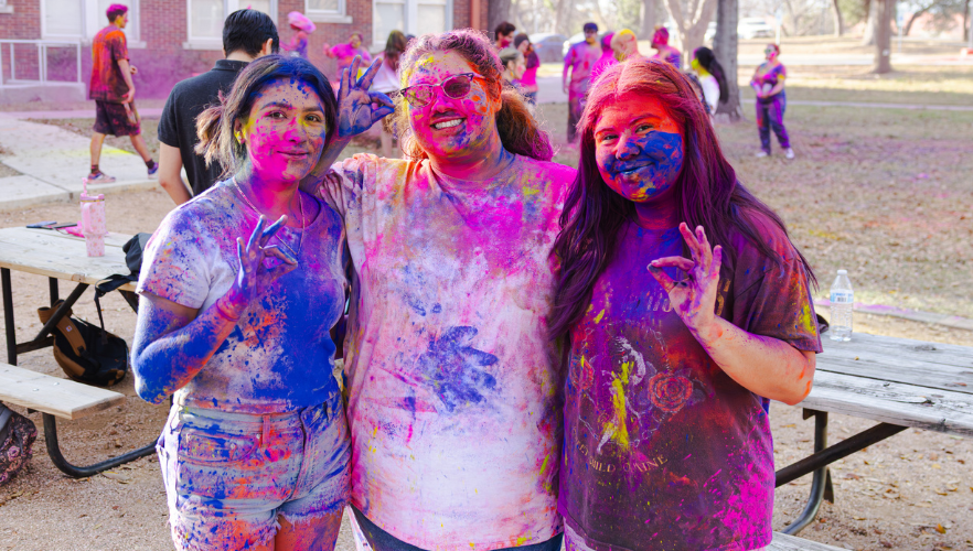Students at Holi color throw