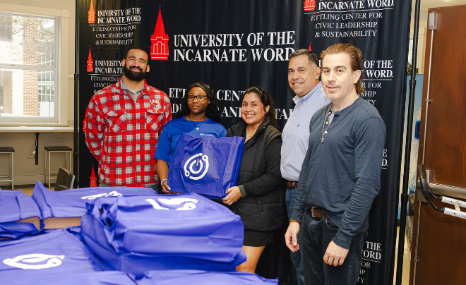 Ettling Center representatives and laptop drive