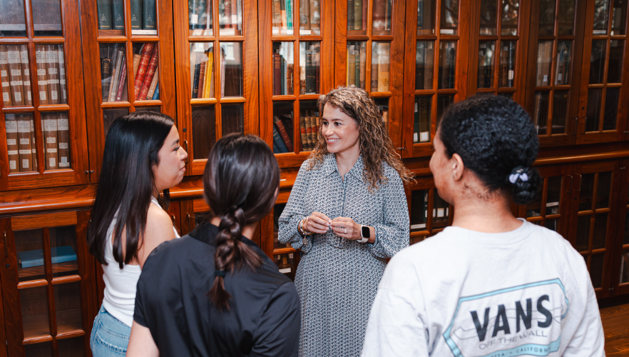 Ada Saenz talking with students