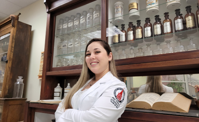 Woman in white coat smiling