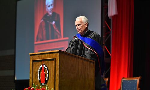 UIW Professor Emeritus during his speech