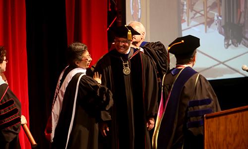 Chairman Charlie Lutz secures Presidential Medallion on Dr. Evans