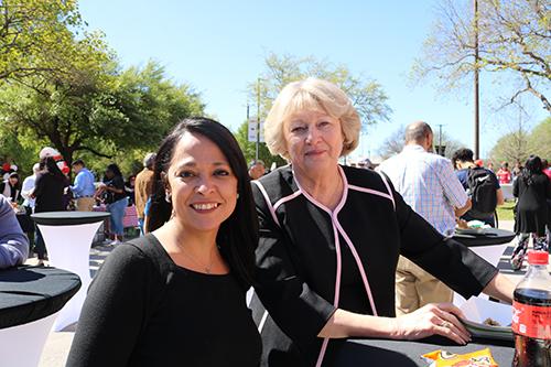 Two Faculty Members at a table