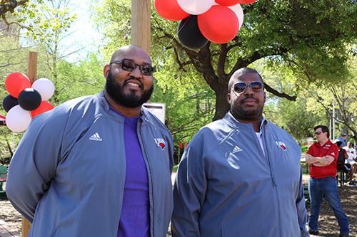 Two Faculty members standing together