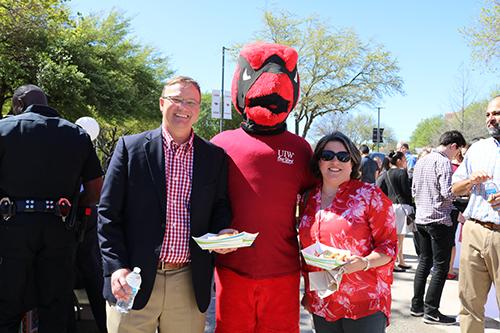 Two Faculty Members posing with UIW Mascot