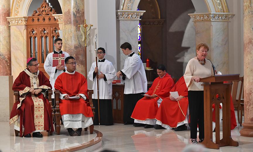 Woman recites Readings for Eucharistic Celebration