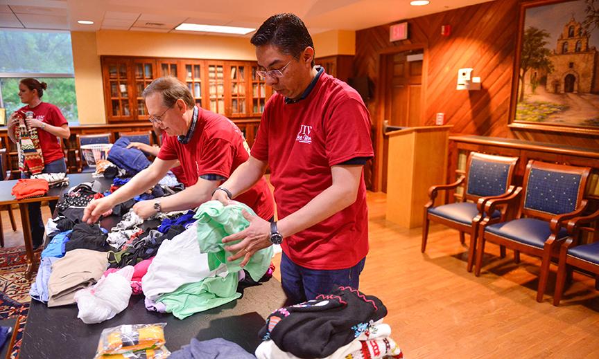 Volunteers organize clothes