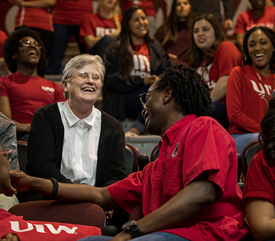 Sr. Walter Maher talking to campus members