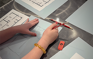 fashion student working on a floor plan