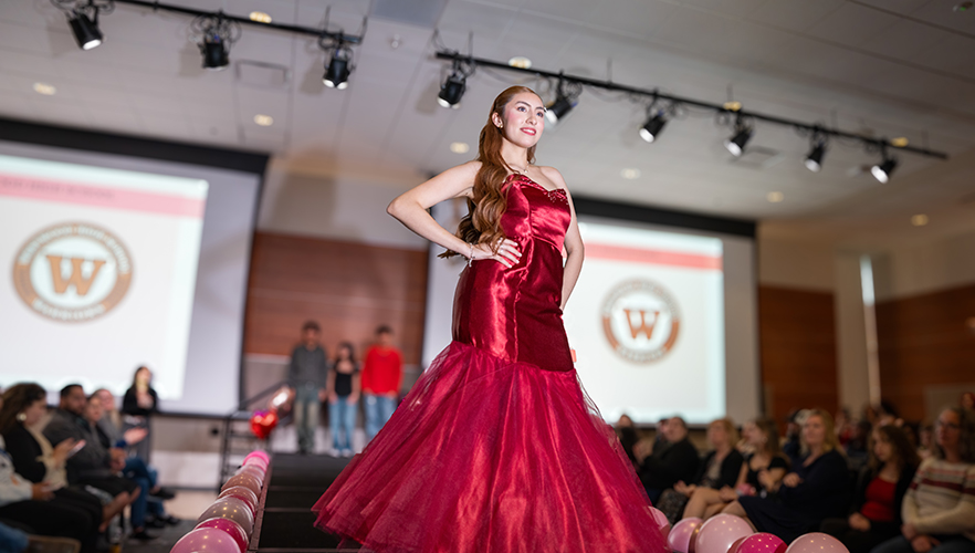 Model on stage at Red Dress Fashion Show
