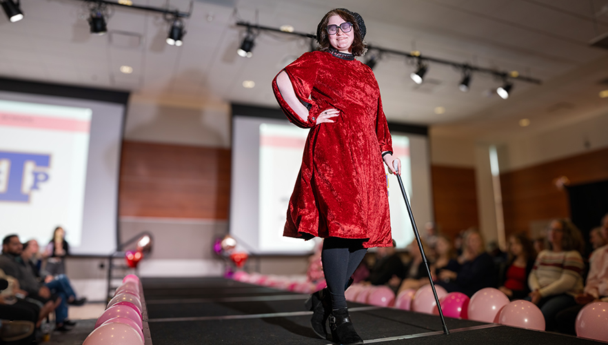 Model on stage at Red Dress Fashion Show