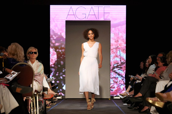 Model walking down the runway at a fashion show