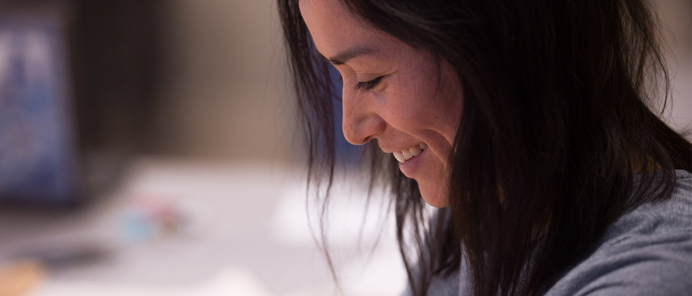 Close up of a smiling fashion design student