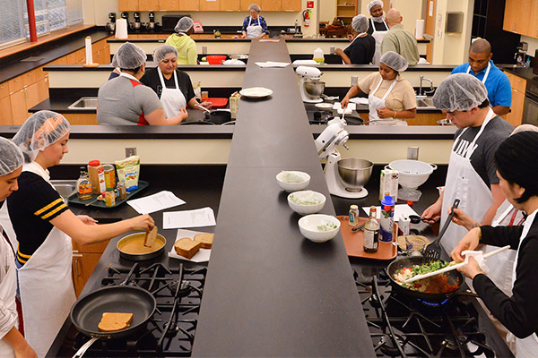 Nutrition students in groups in a classroom