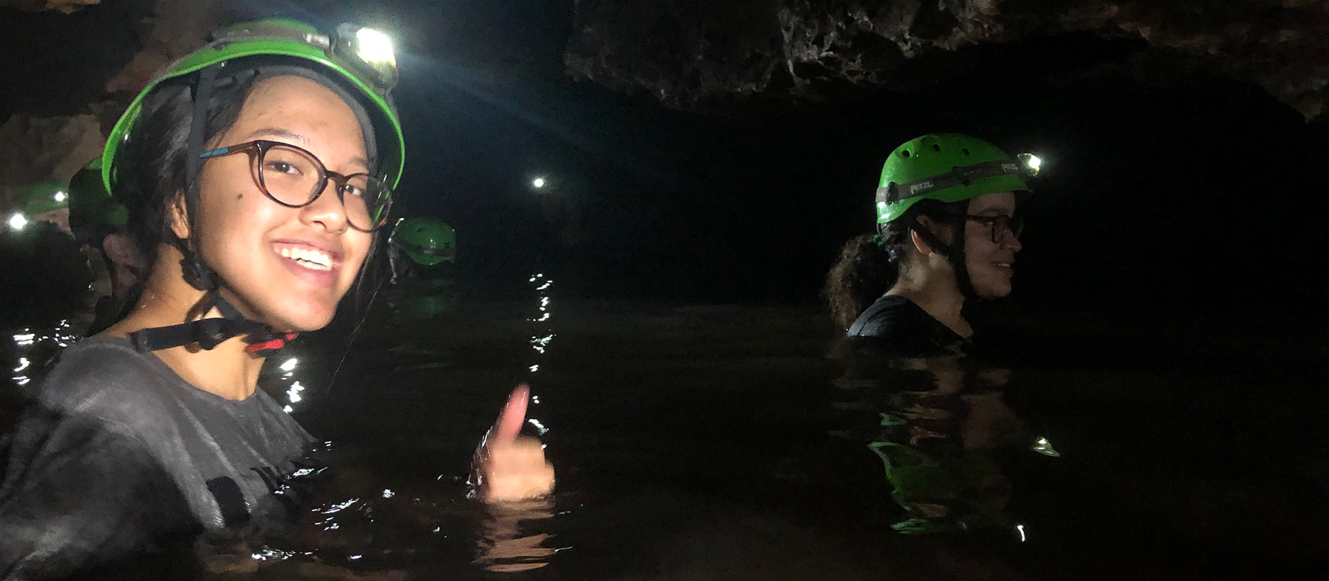 biology student in an underground cave