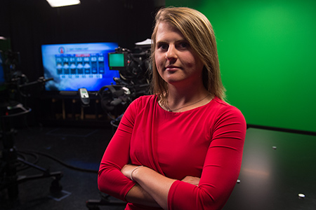 meteorology student in front of green screen in studio