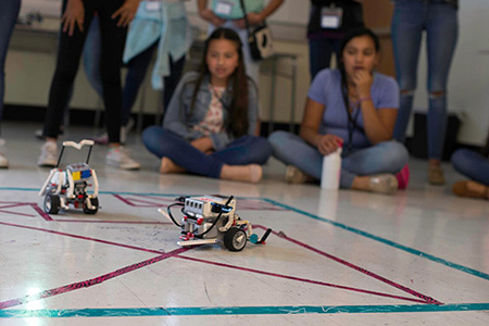 A robot on wheels on the ground