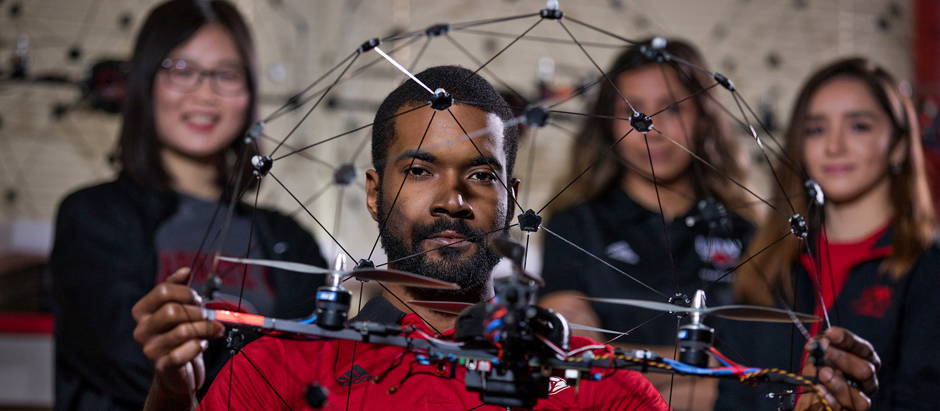 engineering students posing with an UAV