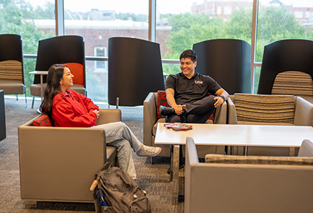 Two students hanging out in the SEC