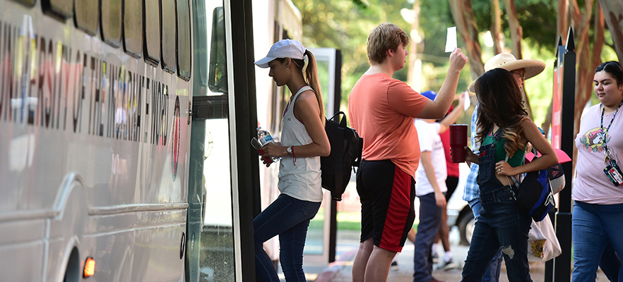 Students getting on the UIW shuttle bus