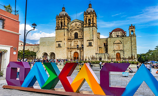 Cathedral and city sign, Oaxaca, Mexico